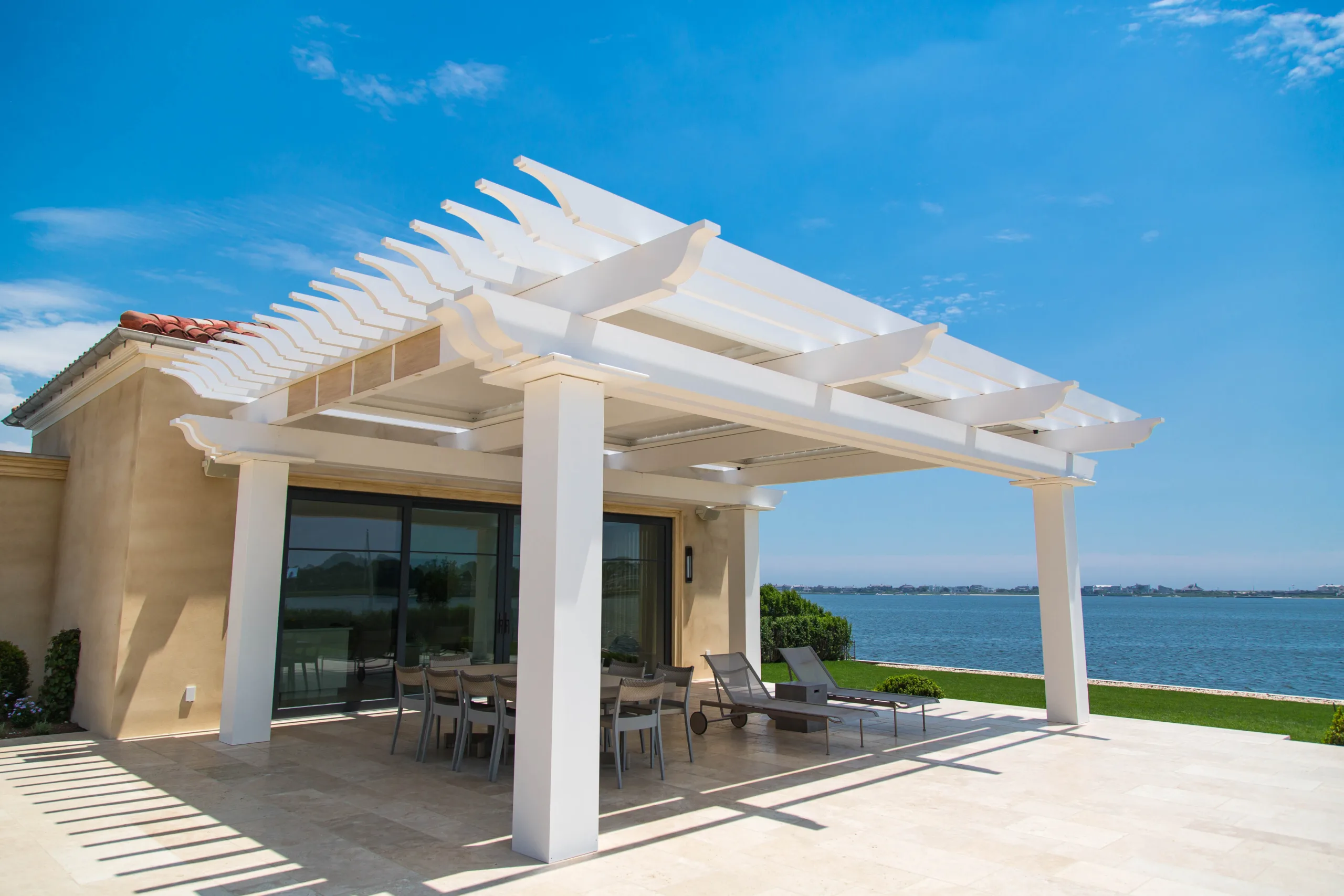 Cellular PVC Pergola on back patio overlooking the water